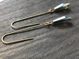 Elegant gold-tone drop earrings with iridescent stones for a chic, modern look.