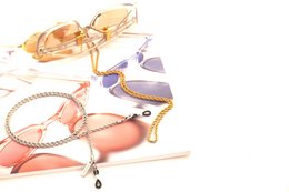 Twist It - Glasses Chain is a stylish and functional accessory for holding eyeglasses. Available in silver and gold finishes with grip or clip options, it features a unique twisted design that securely holds glasses in place.