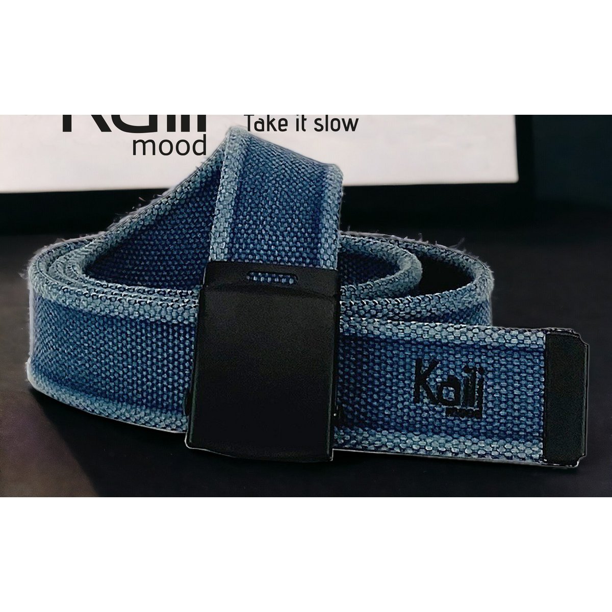 K4010DB | Stone Washed Canvas Ribbon Belt Col. Blue with Matt Black Buckle. Dimensions: 125 x 4 x 0.5 cm One size - Can be shortened. Packaging: Rigid bottom/lid gift box
