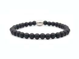 Matte black obsidian bracelet with adjustable sizing from XS to XL.