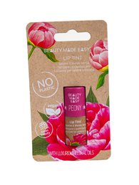 Tinted lip balm in peony color with natural ingredients and no artificial additives.