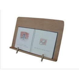A wooden reading and music stand with a pear-shaped holder, designed for children's musical toys.
