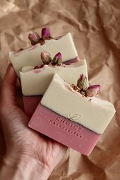 Natural, vegan, palm oil free soap bars with mint and rose scent, decorated with dried rose petals.
