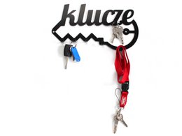  Black metal key hanger with the word "Klucze" written on it. The hanger has two keys attached to it, one red and one blue.