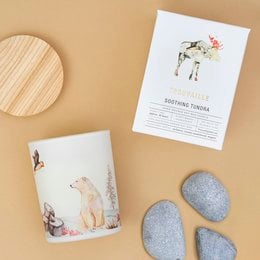 Soothing tundra-scented soy wax candle with a nature-inspired design featuring a moose. The candle is made from sustainable soy wax and has a long-lasting burn time.
