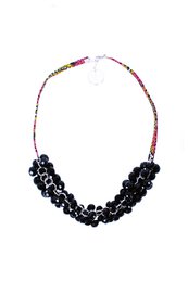  A black beaded necklace with a statement pendant. The necklace features a mix of black and red beads, creating a bold and eye-catching accessory.