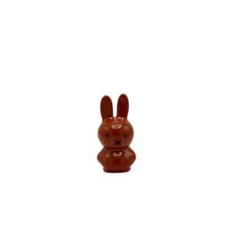 Small brown rabbit figurine with long ears and a round body.