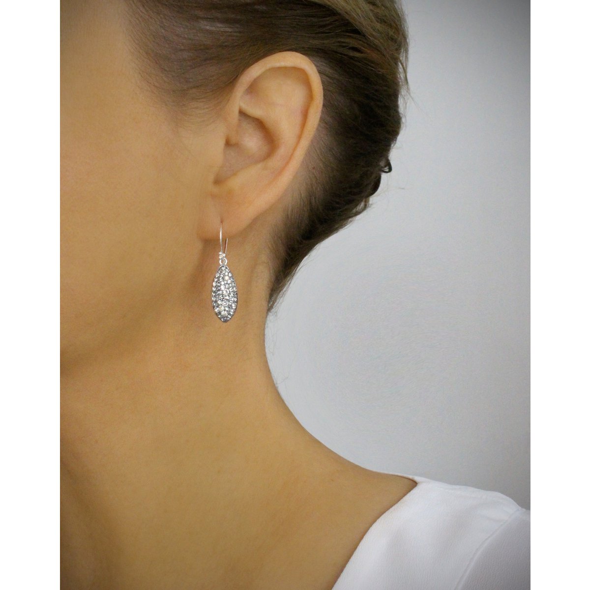 Petite rhodium plated earrings with grey pavé drops
