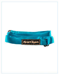 Teal blue bow tie with the "Mountain Feather" logo. Made of a soft, textured material.