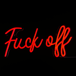 Neon wall light with the text "Fuck off" in red neon. The light is mounted on a dark wall with some plants in the background.