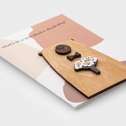 Handmade 3D wooden birthday card with flower design, beige and natural wood colors, interactive pop-up greeting card.