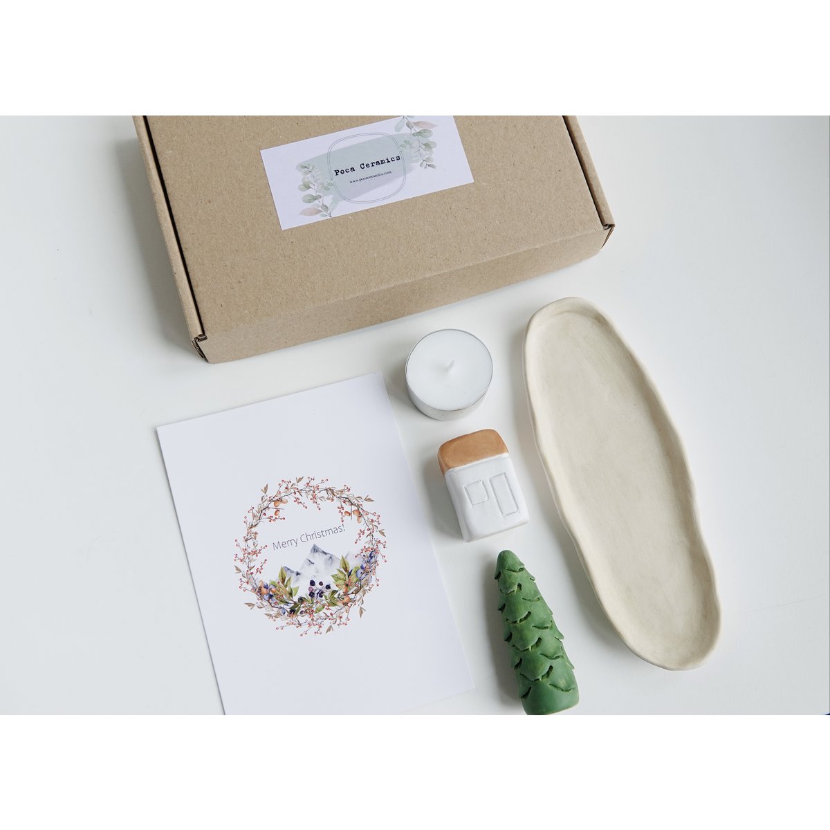 Christmas Giftbox with house, tree and candle