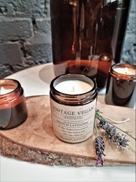 Vintage vegan soy travel candle with lavender scent, featuring a rustic, earthy design.