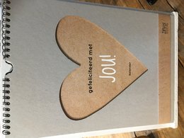 A wall calendar with a heart-shaped design and the text "Congratulations with you" in Dutch. The calendar features various motivational messages and illustrations.