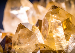  Greeting card featuring a citrine gemstone design. The card has a vibrant yellow-orange color and a crystalline, faceted texture that captures the natural beauty of the citrine stone.